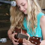 A young musician performs during a Child & Family fundraising event.